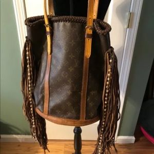 Authentic Louis Vuitton bucket bag with fringe